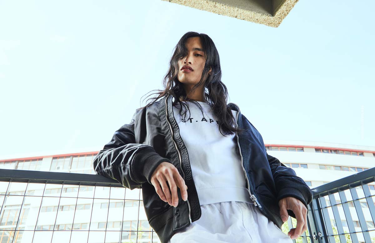 model-agency-management-young-model-asian-long-hair-boy-railing-bomber-jacket