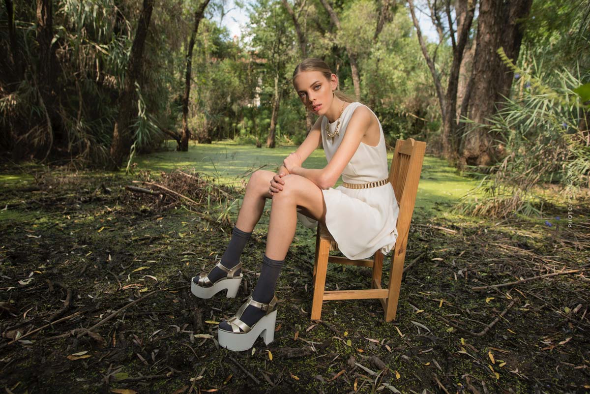 model-agency-management-young-models-swamp-tree-chair-photographer-shooting-dress-high-heels